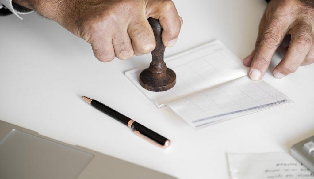 People checking bankbook isolated on white table